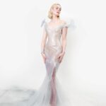 Elle Fanning Instagram - A glass statue stands in her garden, so delicate she could break. But with help from a few friends—the birds, Cartier and Balmain—the Sleeping Beauty is dressed & forever frozen in time… 🕊️🥀🕰️🥀🕊️ Thank you Anna for another unforgettable first Monday in May! @voguemagazine @cartier @balmain @olivier_rousteing @migueldana @samanthamcmillen_stylist @erinayanianmonroe @justjenda @jinsoonchoi @lorealparis @chloerosey