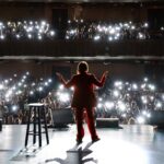 Esther Perel Instagram – And, that’s a wrap.

Four cities and five shows later, the first half of my U.S. Tour has come to an end. One of my favorite rituals after every show is simply being with those I care about. There’s a certain magic in the spontaneity of post-show gatherings, where the connections forged during the performance lead to new moments we couldn’t have anticipated. It’s about more than just talking about connection; it’s about actively creating it, fostering new bonds with family, friends, colleagues, and even strangers who become acquaintances by the end of the night.

After my final show in New York, our post-show gathering was no different. Amidst the conversations, a friend’s comment resonated deeply: “You made the Beacon Theater feel like a living room.” It was a touching recognition of the atmosphere we had cultivated.

This is exactly what I set out to do. In my recent newsletter, I expressed that while I can’t fit you all on my couch, we can gather in a theater to immerse ourselves in the intricacies of love and desire, which are often grappled with alone. My intention was to foster an experience that was both intimate and communal, and each night, that vision came to life—not because of me, but because of all of you who showed up authentically, sharing stories, engaging with each other, and redefining how we connect, how we desire, and even how we love.

I’m looking forward to returning to the stage on the West Coast this September.

Photo Credit: @tobytenenbaum