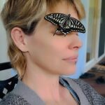 Evangeline Lilly Instagram - Playing with a little friend 🦋 I think all the rain we got on the islands in the past 24hrs wet his wings and he was waiting for them to dry. #butterfly #nature #naturesbeauty