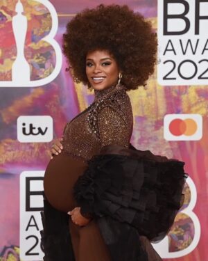 Fleur East Instagram - Baby at The Brits! Me and bump made it to what will probably be the last glam night out for a while, replaced by night feeds and nappies 😂 so I made the most of it with my @hitsradiouk fam. What a night! @brits 

Big up the amazing team that made this entire look possible. Thank you for making me feel fabulous! 🙌✨🥰

HAIR: @jhair_stylist 
MAKEUP: @anais.haz 
CUSTOM OUTFIT: @vickygilldesign