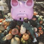 Gabby Barrett Instagram - Crazy! The last time we were at this pumpkin patch, I was pregnant with Baylah & now she’s feeding the goats like a natural! (Now pregnant with her brother lol) Time flies. What a JOY she is. 🤍🎃