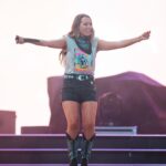 Gabby Barrett Instagram - Last night was unforgettable!! Obsessed with my @YellowRosebyKendraScott @kendrascott jewlery ✨ #kendrascottpartner Outfit: Shirt customized by @starstruckvintage Shorts @idyllwind @mirandalambert Tights by @wolford Boots by @danielxdiamond Jewelry by @YellowRosebyKendraScott @kendrascott Bandana customized by @fablesbybarrie Belt by @akira