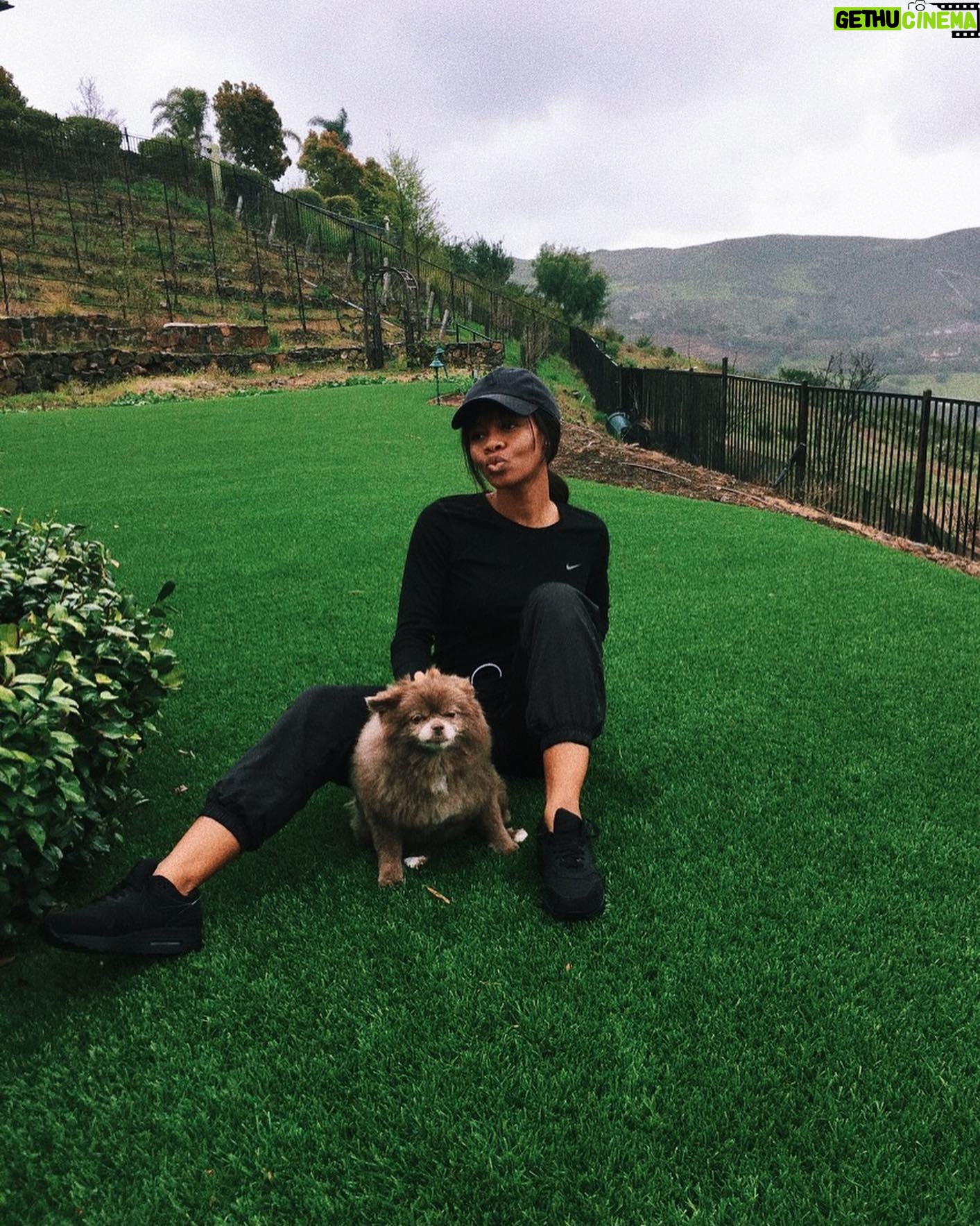 Gabby Douglas Instagram - hoping you all are safe and healthy, sending you all my love. also, cali was mad at me because we took the photo in the rain...
