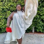 Gabourey Sidibe Instagram - Y’all about to get this look in about 30 different post over the next few months cuz I’m not going outside anymore. It’s not even about Covid. I just get hung over if I don’t get in the bed by 6pm. Anyway, Styled by @kellyaugustine and assisted by @couturemoments_ in a @nerecinacouture dress with @commedesgarcons @converse cuz my ankles ain’t ankling like they used to. And get into this eye makeup!! @tobyfleischman went OFF!