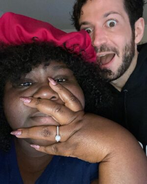 Gabourey Sidibe Instagram - It’s weird that people think we’re already married but I guess our hearts and intentions for each other are just that clear to see.  My BFF proposed and now I get to hold him forever.  The funniest man I’ve ever met. The sweetest human to exist. @brandontour made up a song for when i put my bonnet on at night.  The second I look a bit stressed and overwhelmed, he jumps into action to take over what he can for me. Every moment with him is a joy.  He is the partner i thought I was too independent to need. I’ve learned so much about myself through him and I feel grateful and excited to learn more about the entire world with him by my side.  My partner, my best friend, my cats’ daddy,  my mans, my heart, my fiancé!!! ❤️❤️❤️❤️