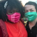 Gabourey Sidibe Instagram - These are our official wedding photos! The Wedding at the kitchen counter featuring our rings by @happyjewelers, followed by an extremely lit reception with Aaron sniffing flowers sent to us and then a very romantic sunset dinner featuring our mask because we were still in the thick of the pandemic. We really do want to have a wedding someday but I just couldn’t wait to marry this amazing man.