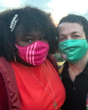 Gabourey Sidibe Instagram - These are our official wedding photos! The Wedding at the kitchen counter featuring our rings by @happyjewelers, followed by an extremely lit reception with Aaron sniffing flowers sent to us and then a very romantic sunset dinner featuring our mask because we were still in the thick of the pandemic.  We really do want to have a wedding someday but I just couldn’t wait to marry this amazing man.