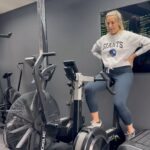 Gemma Atkinson Instagram - Here’s some of my PP rehab so far. *I’ve been cleared by my Women’s health physio to start these and you must, MUST get the go ahead from a professional before starting any exercise postpartum, especially after a C section * Mine was also overseen by Mia 🥰😂 1. 10 mins on the bike to flush my legs. I have it on the lowest bumper level 1 and no more than 65 RPM 2. Chest opener stretch. My chest is tight from being hunched over nursing & carrying Tio so this feels great to loosen things. I do 1 min each side. 3. Pelvic tilts. This is such a small movement but great for rebuilding pelvic floor strength. 4. Glute bridge with pelvic floor squeeze. Again, nothing strenuous but focusing on my pelvic floor (imagine a zip running from your rib to your bum and slowly zipping it up and down) 5. Bird dog. I did loads of these after Mia, they again strengthen the core and improve stability which after having my massive bump & boobs I lost! I was almost toppling over 😂 Make sure to squeeze and engage core before each movement. 6. V stretch on wall. This I do to open my hips and just because it feels really nice on my lower back. 7. I finish with 2 mins (trying to build up to 3) in the ice bath to help reduce inflammation and most importantly boost my mood! As you can see it’s nothing strenuous. I’m starting from scratch and my goal at the moment is just to rebuild my pelvic floor and close any Diastasis recti (which is common in pregnancy & postpartum) I’m not sure how wide my tummy gap is yet, I’ll find out on Wednesday after my mummy MOT. Kat from @hatch_athletic is overseeing my PP rehab and like I said, she’s given me the all clear after our assessment. Please don’t just start without getting the go ahead. Every pregnancy, and every postpartum journey is different. Take your time and trust the process. Small steps is the way forward ♥️