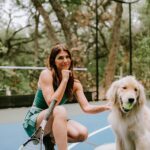 Genevieve Padalecki Instagram - Tennis paw-tnership at its finest. 🎾 Head to @towwn today to catch some of my favorite sustainable workout wear brands.