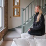 Georgia Hirst Instagram - At home with Actor Gee Hirst 💚 Creating a cosy country-feeling home in London through warming beiges and earthy greens alongside brushed brass finishes, soft layered lighting and thoughtful antique pieces. "When I bought the apartment, it was pretty lifeless and cold. I met my boyfriend who had always fantasied about having a country home and so we started this renovation project together. We introduced warmer tones through the paint colours - all Lick - textiles and finishes to give it a relaxing, 'Soho Farmhouse' countryside retreat feel in the middle of the city." Paint colours used: • Living room, dining and kitchen (walls): #Beige01 • Kitchen cabinets: #Green02 • Staircase woodwork: Green 02 • Bedroom: #Beige02 Soho Farmhouse • Spare room: #Green05 Rome House See the full home tour on the Lick YouTube channel (link in bio) #LickHome #housetour #apartmentdesign