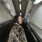 Gia Kim Instagram – Room full of beautiful people, but it’s the company that makes perfect 🥹💞
@pradabeauty 🤍
.
.
Reusing a dress I’ve worn for a birthday, the necklace I bought 10  years ago in university. Coat thrifted from Crossroads.