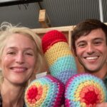 Gillian Anderson Instagram – Wanted to say a huge huge thank you to the darling @tomdaley for knitting this fantastic jumper (and crocheted willy 🌈) for me to wear for our final season of @sexeducation! 🧶🍆

Together we raised just over £12k for @mindcharity, which will be divided amongst 8 local Minds who work with LGBTIQA  communities. Thank you for your stellar knitting skills Tom and for coming to visit me on set! 

Swipe to the end to see the post that started it all (in 2021 🤯)