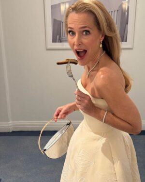 Gillian Anderson Instagram - Sometimes you just need a sausage to go with your yoni dress.