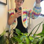 Gillian Anderson Instagram - Wanted to say a huge huge thank you to the darling @tomdaley for knitting this fantastic jumper (and crocheted willy 🌈) for me to wear for our final season of @sexeducation! 🧶🍆 Together we raised just over £12k for @mindcharity, which will be divided amongst 8 local Minds who work with LGBTIQA communities. Thank you for your stellar knitting skills Tom and for coming to visit me on set! Swipe to the end to see the post that started it all (in 2021 🤯)
