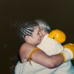 Gina Carano Instagram - This is my Grandfather Jack (Papa) and I. We always had such a close relationship, he only came to one of my earlier Muay Thai fights because his heart couldn’t take seeing it more than once. 🫀 I understood. He was the best coach I’ve ever had, my mentor and friend, I miss him daily. I’m wishing you the ability to be present with your loved ones this holiday season. Hug the ones you love while they’re here. Cherish their words and stories, bring grace and mercy to the table and don’t miss the opportunity to let them know how much you love them. Life is precious, make it count. ✨