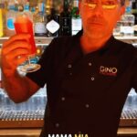 Gino D'Acampo Instagram - Never a dull moment when Gino is in town! We asked you what your favourite Gino memory was, and we made a cocktail out of it! Here’s Gino mixing one up in the beautiful @lucianobyginodacampo 🍹👨🏽‍🍳 #cocktail #cocktails #ginodacampo #ifmygrandmotherhadwheels #italian #italaindrinks #gino #ginoclock #londonlife