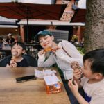 Grace Chan Instagram - When you have 3 kids, everyday is children’s day🤣🩵💚🤍 My dad always tells me that out of the three of us (my older sister & my twin bro) I was always the first one to run in front of his camera Slap on the biggest smile and say CHEESE! 😁🧏🏻‍♀️ Maybe it was because I knew how happy it would make him then But little did I know how happy I would feel seeing these photos now. A picture isn’t just worth a thousand words, It’s worth a lifetime of memories🤍 If there’s one advice I would share with other parents, It’s to take more photos, record more videos And capture those funny, sweet, random little pieces of life for your kids to look back at one day. Happy Children’s Day 🧸🎀
