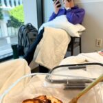 Grace Helbig Instagram – Scenes from chemo round 5! We’re officially 5/6th of the way through chemo!!! I can’t even process that right now, it’s all been so surreal. I brought this hat gifted to me by a friend of @mametown’s for a lil photo shoot. (If you listen to TMGW you know!) @elliottmorgan thought it was maybe “too dark” of a joke. Maybe he’s right, but I’ve lost my baseline for what’s normal or appropriate or “real life” at the moment so we’re just having fun! 5 infusions down! The adorable horrors of recovery await but we’re fucking doing it! 💪🏻🙃 #aintdeadyet