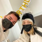 Grace Helbig Instagram - Today’s my birthday and we’re celebrating a little differently this year! It’s chemo round 3 bb!!! But @elliottmorgan set up these streamers and put this hat on me because he’s ADORABLE and it’s a good thing it looks so funny bc if it didn’t it would look very sad lol. It looks like how I feel: giving it my best shot. It’s been a real journey so far and it feels weird but appropriate to spend my birthday in a chemo chair. Thanks for all the well wishes and warm messages! We’re doing it!! And at least there’s still cocktails. 🙃