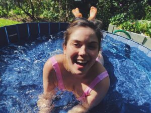 Gracie Gillam Instagram - How much I like Hildy’s dog pool vs. how much Hildy likes Hildy’s dog pool 
(@natjohnzang got me this @robineisenberg swim suit! Am I a space girl yet?!)