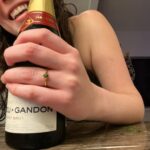 Gracie Gillam Instagram - A gathering of 2021 highlights! 1 - Nat surprising me with a fuck ton of flowers on my birthday as Talia gave me a tarot reading 2 - Making fried green tomatoes (grown in my garden) in Port Washington with Melissa, Tim, Milo, Ruby, Tom and Colette 3 - Ruby casts a sparkler spell on the 4th of July 4 - NYC for Talia’s birthday where they asked the driver to play his favorite music and we all sang Journey together 🎶 5 - A Virginia beach with my little cousins 6 - Giving my Mimi a facial while wearing her old outfit 7 - Evan and Asher play music during Evan’s birthday party 8 - Desert romp with my family as the dogs frolicked among the saguaro cactuses 9 - Popping a demi bottle of Champagne after Nat popped the question (with a gorgeous Fox and Stone raw emerald ring) 10 - Screenshot from the video Nat got of the proposal (which I won’t post here bc I didn’t know I was being filmed and it’s not PG throughout)