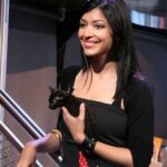 Hannah Simone Instagram - That time I was a VJ for Much Music in Toronto and went into a pet store to buy food for my old cranky cat Jake and I heard the owner muttering that she had found a nearly dead blind rat and she was going to throw it out. She lifted it up and I saw the two most beautiful little scared eyes. After a chat I said I’d take the rat home and care for him until he passed peacefully … he was clearly on his way out of this world. He was 400 grams, maybe a month old and couldn’t stand up because his head was heavier than his tiny skin and bones body. Oh and he was a cat not a rat. I named him Frank and took him everywhere and my cranky old man cat Jake turned into a fully gentle mama bear. The rest is history. Frank my lil blind asthmatic cat kept his tiny wily heart going and became one of my best friends. Jake and Frank became the Bert and Ernie of my life. Everyone who has met him loves him instantly. He never really grew much and so he is just a permakitten. Here is his on screen debut on live tv where I introduced him to the nation xo @havecatzwilltravel (my cats insta if you want more Frank and co content) AND YES THIS IS WHAT I LOOKED LIKE BEFORE BANGS GET OVER IT AND FOCUS ON FRANKIE BOY 🐈‍⬛