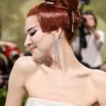 Hari Nef Instagram - my second #metgala—and nothing compares. @voguemagazine, anna wintour, and andrew bolton: thank you as ever for including me i wore custom @hm with a corset underneath by the legendary @misterpearlofficial the met's dress code this year, 'the garden of time,' samples its name from a short story by j.g. ballard. it's a fanciful little allegory which, the way i saw it, unmines the tension between the future and the past this lead me to think about high glamour: how it looks, why it looks like that, where it comes from. i took my 'avedon fashion' book off the shelf, opened it up. i locked onto margot mckendry in the background of a photo from 1961 (slide 3). she reminded me of crystal labeija (slide 5) in frank simon's 1968 documentary 'the queen,' which goes behind the scenes of a manhattan drag pageant (in 1968, dressing in drag was effectively illegal). so i thought about how the visual ideal of glamour travels, from high society to its fringes—and all the way through the decades. what does it mean for me, a card-carrying member of "the new world" (and you know exactly what i mean) to evoke the glamour of the old world? and what did it mean for my sisters who came before me? their beauty and grandeur moves me; i reflect on what they risked for it. i wanted to honor them last night thank you @chrishoran20 for your vision and hustle and for keeping me on best dressed lists—and occasionally worst-dressed lists, which is always cooler! no one does it like you thank you to @hairbyorlandopita and @yadim for sanctifying me from the neck up. i can't believe i get to be coiffed and beat by such absolute mavericks. yadim used @valentino.beauty...i hear there are some exciting things going on over at maison valentino in the near future ;) thank you to @aarondnewbill and @meansss at @imgmodels for keeping me in fashion. i love you and congratulations to @condeunited who won the day :)