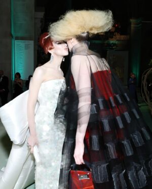 Hari Nef Instagram - my second #metgala—and nothing compares. @voguemagazine, anna wintour, and andrew bolton: thank you as ever for including me

i wore custom @hm with a corset underneath by the legendary @misterpearlofficial 

the met's dress code this year, 'the garden of time,' samples its name from a short story by j.g. ballard. it's a fanciful little allegory which, the way i saw it, unmines the tension between the future and the past

this lead me to think about high glamour: how it looks, why it looks like that, where it comes from. i took my 'avedon fashion' book off the shelf, opened it up. i locked onto margot mckendry in the background of a photo from 1961 (slide 3). she reminded me of crystal labeija (slide 5) in frank simon's 1968 documentary 'the queen,' which goes behind the scenes of a manhattan drag pageant (in 1968, dressing in drag was effectively illegal). so i thought about how the visual ideal of glamour travels, from high society to its fringes—and all the way through the decades. what does it mean for me, a card-carrying member of "the new world" (and you know exactly what i mean) to evoke the glamour of the old world? and what did it mean for my sisters who came before me? their beauty and grandeur moves me; i reflect on what they risked for it. i wanted to honor them last night

thank you @chrishoran20 for your vision and hustle and for keeping me on best dressed lists—and occasionally worst-dressed lists, which is always cooler! no one does it like you

thank you to @hairbyorlandopita and @yadim for sanctifying me from the neck up. i can't believe i get to be coiffed and beat by such absolute mavericks. yadim used @valentino.beauty...i hear there are some exciting things going on over at maison valentino in the near future ;)

thank you to @aarondnewbill and @meansss at @imgmodels for keeping me in fashion. i love you

and congratulations to @condeunited who won the day :)