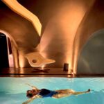 Hayley Atwell Instagram - Villa no. 4 @kivotossantorini is a seductive, cavernous dwelling built into the edge of the caldera where mid-century modernism meets ancient Cycladic charm. The lights dance from orange to purple and green and music travels through each curved room. 🇬🇷