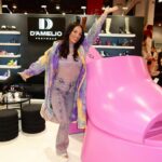 Heidi D’Amelio Instagram – You know it’s a good day when you see the giant pink Ravina shoe! 😍 Back at it in Vegas for @projectshow with @dameliofootwear! 

…y’all already know I still had to dress up for Mardi Gras while I’m here 💜💛💚