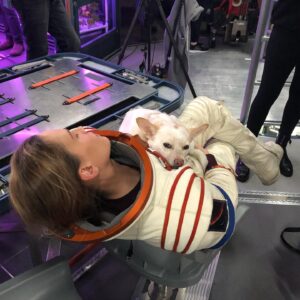 Hilary Swank Instagram - Whether it’s working, hanging out, playing or resting, this is my ♥️ dog, @mamamoon 
I’m so grateful to have found her on a 200 mile desolate highway in 28°, pregnant and to be able to help her. She is paying me back in spades and then some. You may remember I told you I was claustrophobic in my spacesuit and had to work really hard through it, she was a huge component of that. She just knew, she would struggle to get out of the person’s arms holding her once a take was complete and curl onto my chest and just simply be and breath with me. #WhoRescuedWho?
Thanks @deityanimalrescue for helping us find all her sweet babies homes. We 💜 you angel ladies! #AdoptDontShop #MyUnspokenPet 
#DogsOfInstagram 🐶 🐾 💫💝