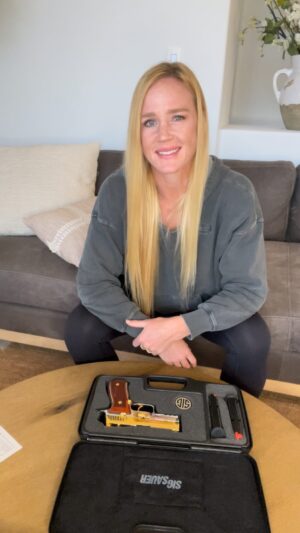 Holly Holm Instagram - Special thank you to @tee_gun_vault for this custom Sig. And thank you to @andreiarlovski for connecting me with Tarek. This Sig is stunning. I’m speechless! This custom work is second to none!!