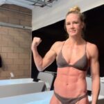 Holly Holm Instagram - 🧊 🧊 😉 looking like a sunburn. As long as I make it past the first two minutes I’m good. But those first two always burn! Today was 6 minutes. Don’t let the frown mislead you… it always feels good afterwards! Thank you @teamturningpoint @athleteoasis for always helping me with recovery. And to everyone that struggles with an ice bath….. I used to not be able to do it because my toes burned so bad. These little booties make it possible for me. So if you’re a wussy at ice baths (like me) these are a huge help. At least it gets me in the ice more often.