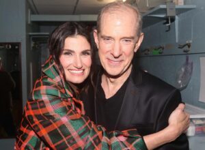 Idina Menzel Instagram - Still reeling from #Wicked20. What an incredible celebration and reunion with so many friends. I’m so proud to be a part of this family. 💚

Photos by Bruce Glikas @bruglikas @broadwaybruce_

Styling: @taraswennen 
Hair: @anthonycampbellhair 
Makeup: @genevieveherr 
Coat: @azziandosta 
Top/Trousers: @albertaferretti 
Shows: @sam_edelman 
Clutch: @jimmychoo 
Ring: @kavantsharart