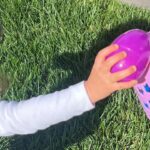 Iliza Shlesinger Instagram - We are Jewish but Sierra’s LA Grandma isn’t which means she gets Easter (and an Easter basket! I’m so jealous 🤍) and we all get Christmas. We filled eggs with Easter “candy” like… raisins and cashews and dried peaches and she had the best time. We did the neighborhood egg hunt too but she didn’t eat the chocolate because Mommy, who never lies, told her it was too spicy. Highlight for me was her holding this little blue bunny so delicately like it was a baby. Nothing will beat last year’s Easter outfit (last slide) but this one came close. 🐣🐰