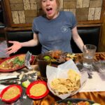 Iliza Shlesinger Instagram – Last Saturday night as the parents of only one child.
We @galuten fully leaned into being an American suburban family of 4 by going to Costco then going for Mexican in the valley. We are so excited to be holding our little boy around this time next week 🤞 shout out to @newbalancelifestyle for keeping me athletic looking from the belly down.