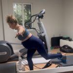 Iliza Shlesinger Instagram - This song’s chorus epitomizes how I’m feeling these last few weeks. Did some new moves today. These work outs are a lot of breaks, Tums, water and just the overall will to move. Tian Fu was there, just not actively participating. 💪 @alishamullally and I’m on the @balanced_body Allegro 2 Reformer