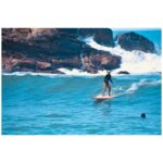 Jackie Cruz Instagram - Catching rays riding waves. ✨🏄🏽‍♀️