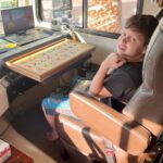 Jacqueline Laurita Instagram - Nicks essentials when traveling. DVD player, multiple dvds, this specific alphabet puzzle to spell on ( that’s unfortunately no longer in production), 2-3 iPads(one back up in case one dies, and the other is strictly a talking device), his favorite books, his glass water bottle, front seat of the motor coach the whole way with everything next to him! He was perfect! 🤗❤️