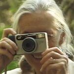 Jane Goodall Instagram - Dr. Jane Goodall wears many hats: 🐵 The researcher, studying wild chimpanzees in Gombe, Tanzania 📢 The activist, promoting respect for people, non-human animals, and the ecosystems we inhabit together 📖 The author, writing down the stories and insights of her life to inspire generations now and to come But did you know that she has also tried her hand at photography? 📷 From chimpanzee portraits to selfies, keep an eye on our photo credits to discover some of Jane’s snapshots! In honor of Jane’s milestone 90th birthday this year, @vital.impacts is holding a special 90-day fine-art photography sale exclusively featuring the work of 90 female photographers who are inspired by Jane! Exclusive, signed prints of Jane’s self-portrait (last slide) and photographs of her beloved F-family of chimpanzees are also available. All proceeds for the sale will directly benefit the Jane Goodall Institute’s global chapter. Learn more and shop the sale — LINK IN BIO 🎥/📸 credits: Video: Hugo Van Lawick Image 1: Screenshot taken from footage by Hugo Van Lawick Image 2: JGI/Jane Goodall ..... @amivitale #JaneAt90 #Janeofalltrades #vitalimpacts #photography #wildlifephotography #femalephotographers #janegoodall #janegoodallinstitute #chimpanzees #conservation #nonprofit #chimpanzeeconservation #interconnected #communityledconservation #communityconservation #wildlife #africanwildlife #tacare