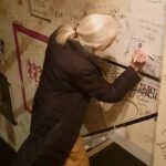 Jane Goodall Instagram - Appreciation post for our fellow doodlers! 🎨✨ If you ever get the chance to peek at Dr. Goodall’s field notes, you’ll notice lots of sketches and doodles scattered throughout its pages. 📝🐵 Contrary to common belief, doodling can actually improve concentration and focus by preventing the mind from wandering too far. In fact, research suggests that doodling while listening can enhance retention and recall of information, while also sparking creativity by engaging different parts of the brain! 🧠✏️ 🎥 Sylvie Alt text: an older woman with fair skin and white hair pulled back into a ponytail (Dr. Jane Goodall) kneels while signing her signature against a white wall filled with other signatures. She doodles a chimpanzee face underneath her signature. #JaneGoodall #JaneAt90 #GoodAllDay #JaneGoodallInstitute #JGI #Doodle #Chimpanzee #DoodleArt