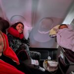 Janette Manrara Instagram - Our first long haul flight and it was not as easy or straight forward as we would have liked, but we made it to Miami and in the midst of the madness we found pockets of joy and excitement to be travelling together as a little family. Also, how cute is Lyra sleeping in the bassinet? 🥰 Thanks for checking in everyone 🤍 #parenting #longflight #travellingwithkids #TheSkorjanecs