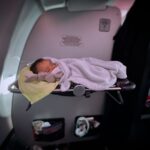 Janette Manrara Instagram - Our first long haul flight and it was not as easy or straight forward as we would have liked, but we made it to Miami and in the midst of the madness we found pockets of joy and excitement to be travelling together as a little family. Also, how cute is Lyra sleeping in the bassinet? 🥰 Thanks for checking in everyone 🤍 #parenting #longflight #travellingwithkids #TheSkorjanecs