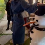 January Jones Instagram - The man of snow I met was very nice but his arms didn’t allow for much intimacy, very pokey, that’s why I’m grazing his top hat awkwardly ☃️