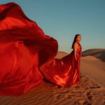 Jennifer Messina Instagram - When the sky lights up red to paint a sunset of gold So fun working with @jennifercmessina over the weekend and looking forward to many more creative adventures 🤍 A huge thank you to @las_vegas_dress for the gorgeous gowns! Go check her out 😎 #photographer #californiaphotographer #arizonaphotographer #photographersofinstagram #glamis #glamisdunes #portraitphotography #lasvegasdress #influencer #artist #photographyart #flyerdress #desertvibes
