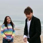 Jenny Han Instagram – IT’S OFFICIALLY SUMMERTIME. The first 3 episodes of #thesummeriturnedpretty are up! (But when we shot this scene, it was late October. SORRY GUYS! 😬🫶🏼)
