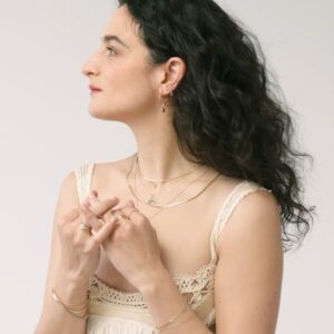 Jenny Slate Instagram - A tiny bit of MAGIC 🪡✨ We present to you a collection with our friend @jennyslate . A tender ode to baubles and braids from childhood, the passage of time, rings to wear after a heartbreak, a bell her mother tied to her shoelaces. “What if we all had a bell for our beloved?” Jenny asked.

Photography: @chloehorseman 
Video: @basilfauchier 
Stylist: @mrmontyjackson 
Makeup: @kirinstagram 
Hair: @anthonycampbellhair