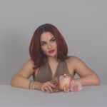 JoJo Instagram - Indulge your senses in my latest limited-edition offering, 𝘗𝘳𝘰𝘴𝘦𝘤𝘤𝘰 𝘗𝘢𝘭𝘰 𝘚𝘢𝘯𝘵𝘰 aka *baby, it’s you*. We combined some of my favorite scents to make a truly sexxyyyy candle. Encapsulated in a coconut soy wax massage oil blend (yes you can use it on your body, baby!) are top notes of sweet amber, dry prosecco, and palo santo. Middle notes are clove, Lilly of the Valley, and a touch of citrus. Grounding base notes evoke a rich mahogany and musk. We are featuring a gorgeous hand- chosen and cleansed sardonyx or apricot agate stone. Sardonyx promotes stability, protection, and happiness. It can attract friends and good fortune and is also known to increase stamina, vigor, and self-control. All important characteristics to employ whether you’re on a self-love journey or in a partnership. Apricot agate is a powerful yet gentle crystal which brings harmony to your energy as well as strength, vitality, and stamina. Our translucent desert rose- colored vessel is reusable and I encourage you to enjoy both the stone and the vessel long after the wax has melted. link in bio ✨🕯️
