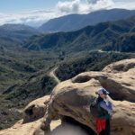 JoJo Instagram - Where do I even begin about the past week?! Hiked 60 miles (more than I ever have in my life) with total strangers. The blisters on my feet prove it 😂. Yoga twice a day. Ate green clean and lean. Gained a new appreciation for my own backyard (Southern California) and lost a few pounds along the way. I had the tremendous privilege of being able to take 6 days away from my phone, emails, regular responsibilities, stimulation, and late night binge eating patterns I had gotten back into over the past few months. Through a practice of hiking 8-12 miles per days and consciously moving and nourishing my body I feel a massive burst of clarity and gratitude. My body, mind, and spirit feel renewed and rejuvenated. Now, nobody has time to do that shit everyday. It’s just not possible in the world we live in! This post is just to encourage you to stretch and move the one bod you got. Get out into nature if/ when you can. I know it’s cold in much of the world!! But when you CAN. It’s often the last thing we want to do. But it makes a damn difference. One of the women I met turned 79 on on the trail. She is more vital and alive and fit than I’ve ever been. Im so inspired. She is goals. And please don’t forget to BREATHE: slowly, deeply, fully. Practice opening your heart. Even though circumstances and history have taught many of us to close off and protect ourselves. It feels so much better not to be on the defense but instead be curious. To go through the pain and unpredictability and be proud of how we handled it. And to eat real food. Of course, literally: do whatever the hell you want 🤍 But I just wanted to encourage you in what I’ve come to find makes me feel most vital and alive over the years. If this sounds woo woo to you then welcome to the freak show baby 😂 After my father passed years ago from addiction/ morbid obesity/ overall poor health it’s become a passion to experience well-being and share what I learn along the way. Wherever you are in your journey I’m right by your side, cheering you on. Mad love, Joanna. cc: @theashram