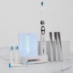 Julie Chrisley Instagram - Hey y'all! Today is the day. Freshen up your spring smile with the brightest, whitest bundle around!! This 2 piece bundle will give you a clean, sparkling smile in no time at all and includes The Brush toothbrush and The Pen whitening pens. Retail $234.99 on sale for The Chrisley Box Family for ONLY $99.95 The sonic vibrations of the The Brush with UV Sanitizer burst away plaque and remove debris while the UV sanitizer kills germs while also functioning as a storage unit for four brush heads and a charging dock for the toothbrush. The Snapwhite Teeth Whitening Pen has advanced gel that whitens BETTER and with LESS sensitivity than competing brands. It's so convenient and easy to use: just smile and brush on some gel. Teeth get whiter with each application. It's perfect for touch-ups and on-the-go whitening. This is a limited time & limited quantity offer! Order now and get this bundle in time for the perfect Mother's Day gift or to treat yourself to a refreshed pearly white smile!! These bundles will ship mid April. Happy shopping and thanks for your continued support! Julie & Savannah Link to buy in bio. #thechrisleybox #spring #chrisleys #buynow #smallbusiness #giveback #gift #giftbox #mothersday #treatyourself #smile #whitening #bundle